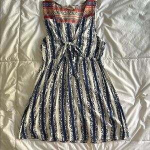 Striped Blue and White Sleeveless Dress it’s marked as  L but it’s fits better S
